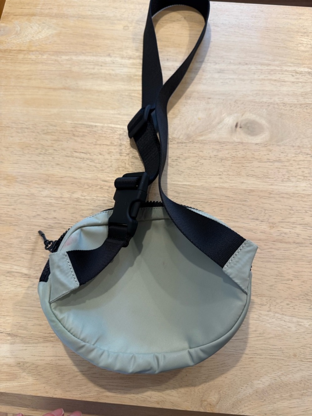 lululemon athletica sage green crossbody sling bag with black strap
